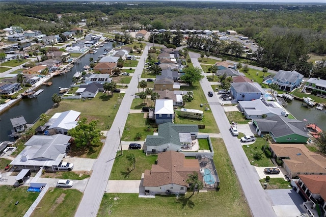 7520 Mako Dr, Hudson, FL 34667 - aerial overview of property's location featuring nearby suburban area, a nearby body of water, and a forest