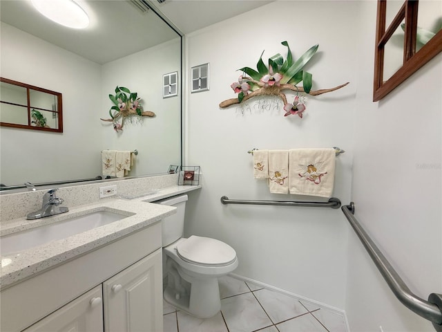 11631 Bayonet Ln, New Port Richey, FL 34654 - bathroom with tile patterned flooring, toilet, vanity, and baseboards