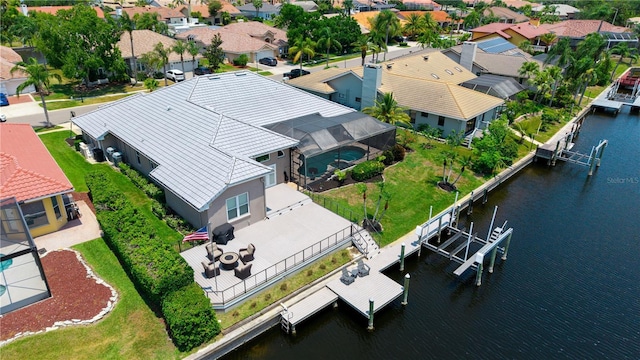 aerial view of residential area with a nearby body of water