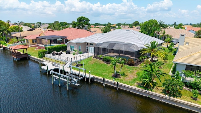 aerial view of residential area featuring a large body of water