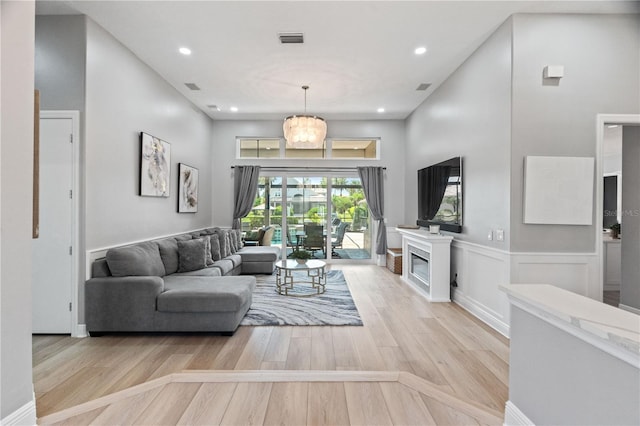 living room with wood finished floors and recessed lighting