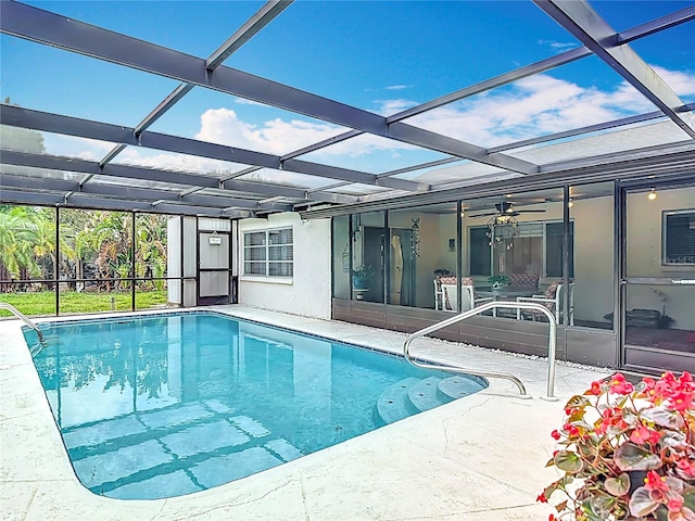 13003 Sandburst Ln, Hudson, FL 34667 - outdoor pool with a patio, a lanai, and ceiling fan