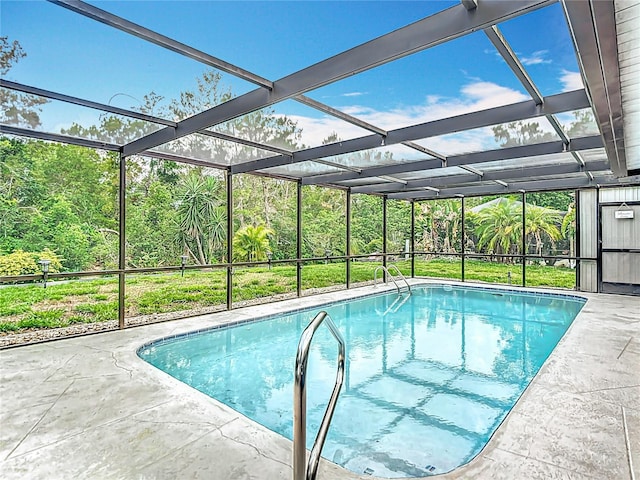 13003 Sandburst Ln, Hudson, FL 34667 - swimming pool featuring glass enclosure and a patio area