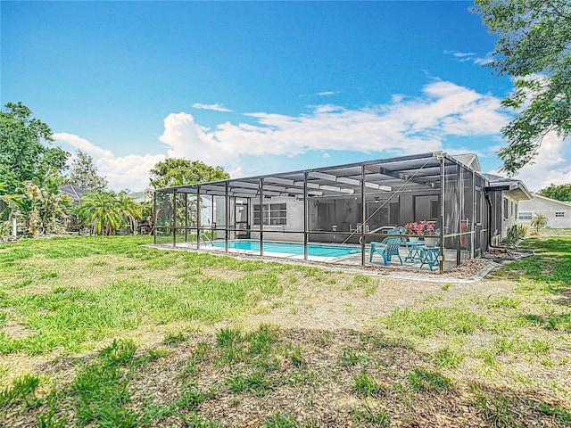 13003 Sandburst Ln, Hudson, FL 34667 - swimming pool featuring a yard and glass enclosure