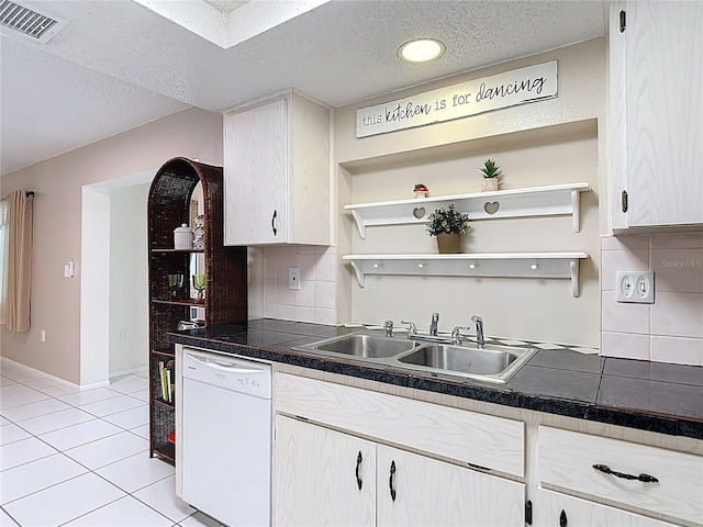 13003 Sandburst Ln, Hudson, FL 34667 - kitchen with dishwasher, a sink, backsplash, open shelves, and a textured ceiling