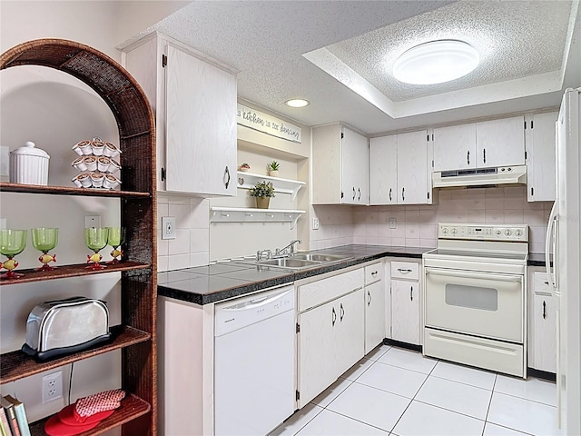 13003 Sandburst Ln, Hudson, FL 34667 - kitchen featuring white appliances, open shelves, under cabinet range hood, a sink, and a textured ceiling