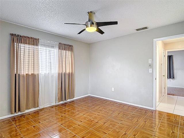 13003 Sandburst Ln, Hudson, FL 34667 - unfurnished room featuring a ceiling fan, baseboards, and a textured ceiling