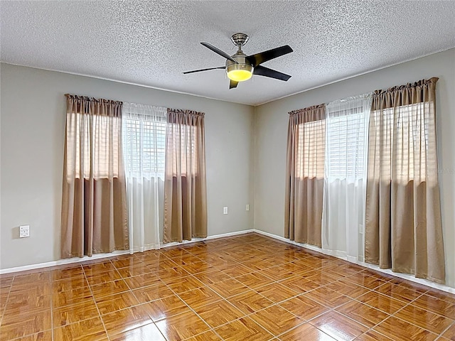 13003 Sandburst Ln, Hudson, FL 34667 - spare room featuring a textured ceiling, a ceiling fan, and baseboards