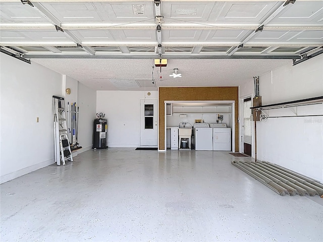 13003 Sandburst Ln, Hudson, FL 34667 - garage featuring washing machine and dryer, water heater, and a garage door opener