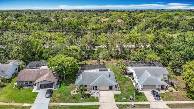 13003 Sandburst Ln, Hudson, FL 34667 - aerial view of property and surrounding area with a forest