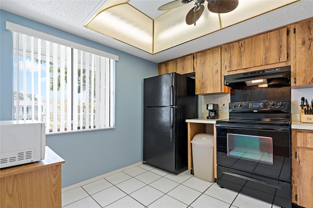306 Martha Ln Unit 42, Oldsmar, FL 34677 - kitchen with black appliances, under cabinet range hood, brown cabinets, and light countertops
