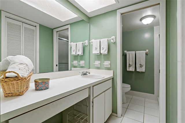 306 Martha Ln Unit 42, Oldsmar, FL 34677 - full bath featuring toilet, vanity, tile patterned flooring, and baseboards
