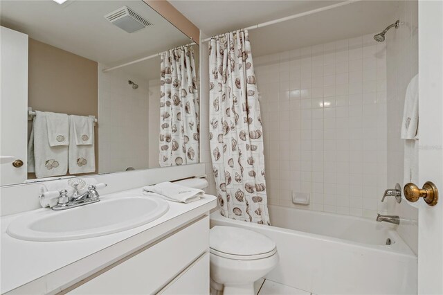 306 Martha Ln Unit 42, Oldsmar, FL 34677 - full bath with vanity, shower / bath combo with shower curtain, toilet, and tile patterned floors