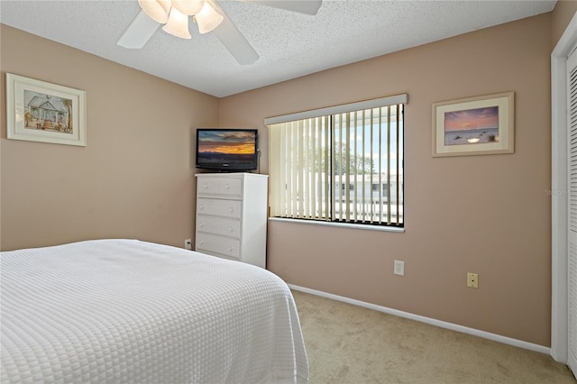 306 Martha Ln Unit 42, Oldsmar, FL 34677 - carpeted bedroom featuring baseboards, a ceiling fan, and a closet