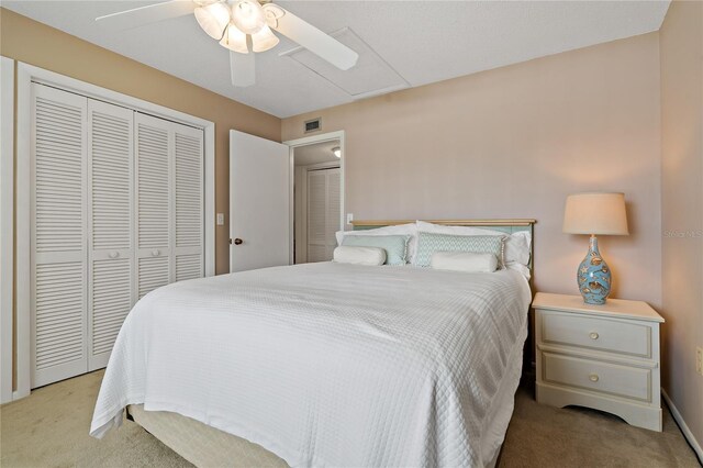 306 Martha Ln Unit 42, Oldsmar, FL 34677 - bedroom featuring light carpet, a closet, and a ceiling fan