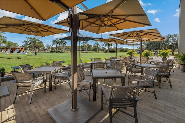 306 Martha Ln Unit 42, Oldsmar, FL 34677 - view of patio with outdoor dining space and golf course view