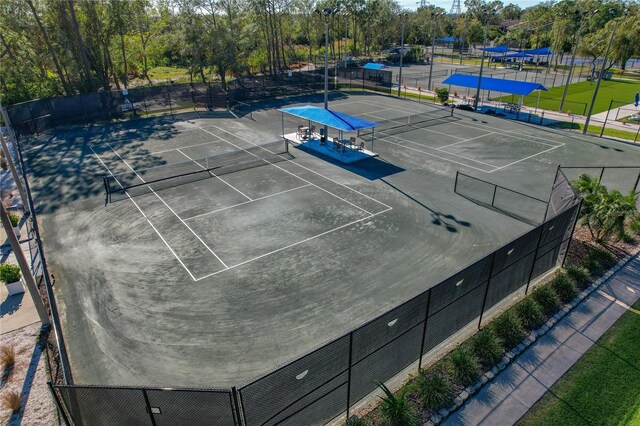 306 Martha Ln Unit 42, Oldsmar, FL 34677 - view of tennis court featuring view of wooded area