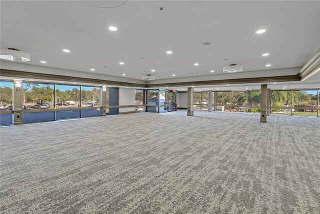 306 Martha Ln Unit 42, Oldsmar, FL 34677 - unfurnished living room with carpet, recessed lighting, and a tray ceiling