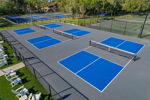 306 Martha Ln Unit 42, Oldsmar, FL 34677 - view of tennis court with view of scattered trees
