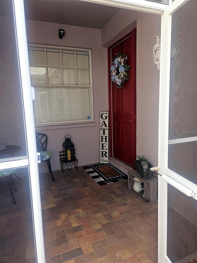 20720 Eustis Rd, Land O Lakes, FL 34637 - view of exterior entry with stucco siding