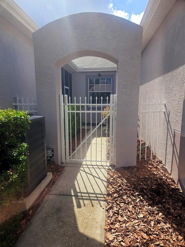 20720 Eustis Rd, Land O Lakes, FL 34637 - doorway to property with stucco siding and fence