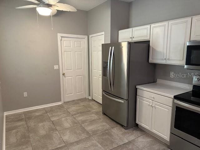 20720 Eustis Rd, Land O Lakes, FL 34637 - kitchen featuring stainless steel appliances, ceiling fan, white cabinetry, light countertops, and baseboards