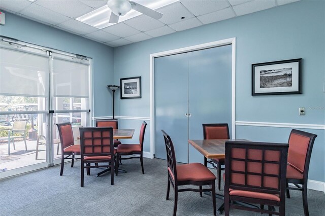 20720 Eustis Rd, Land O Lakes, FL 34637 - carpeted dining space featuring a ceiling fan, a paneled ceiling, and baseboards
