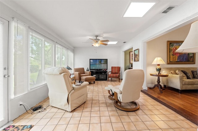 7512 Heather Walk Dr, Weeki Wachee, FL 34613 - living area with ceiling fan and light tile patterned floors