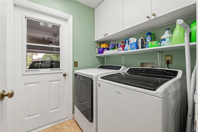 7512 Heather Walk Dr, Weeki Wachee, FL 34613 - washroom with independent washer and dryer, cabinet space, and light tile patterned floors