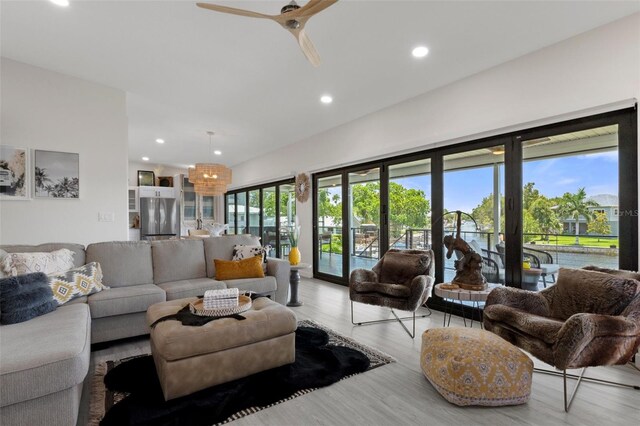 living room featuring wood finished floors, recessed lighting, and ceiling fan