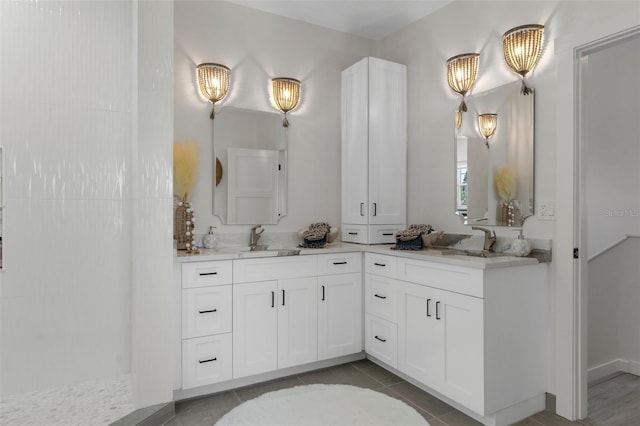 bathroom with vanity, tile patterned floors, and a walk in shower
