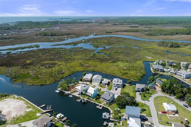 aerial view of residential area with a large body of water
