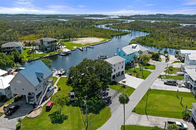 aerial perspective of suburban area featuring a large body of water