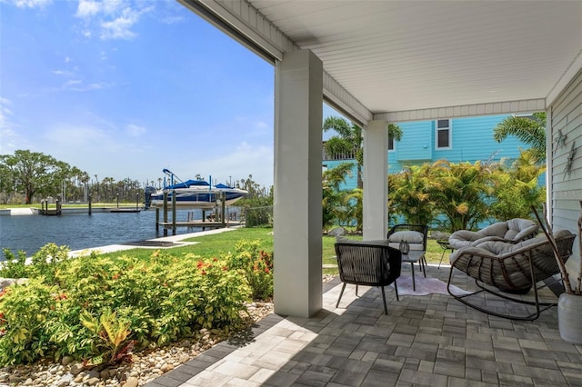5234 Foxhall Ct, Weeki Wachee, FL 34607 - view of patio / terrace with a water view, a boat dock, and boat lift