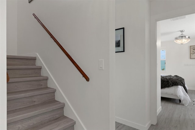 5234 Foxhall Ct, Weeki Wachee, FL 34607 - stairway featuring wood finished floors and baseboards