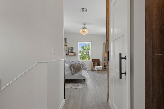 5234 Foxhall Ct, Weeki Wachee, FL 34607 - hallway with wood finished floors and an upstairs landing