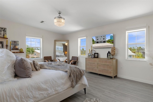 5234 Foxhall Ct, Weeki Wachee, FL 34607 - bedroom with wood finished floors and baseboards