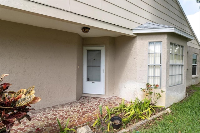 4837 Boonesboro Ct, New Port Richey, FL 34655 - doorway to property with stucco siding