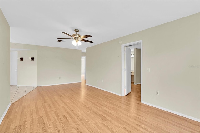 4837 Boonesboro Ct, New Port Richey, FL 34655 - unfurnished room with a ceiling fan, light wood-style floors, and baseboards