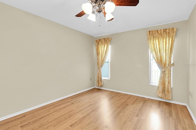 4837 Boonesboro Ct, New Port Richey, FL 34655 - spare room featuring ceiling fan, wood finished floors, and baseboards