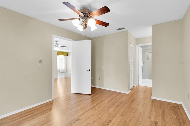 4837 Boonesboro Ct, New Port Richey, FL 34655 - empty room featuring ceiling fan, light wood-style flooring, and baseboards