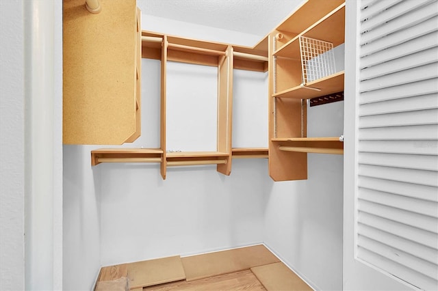 4837 Boonesboro Ct, New Port Richey, FL 34655 - walk in closet featuring wood finished floors