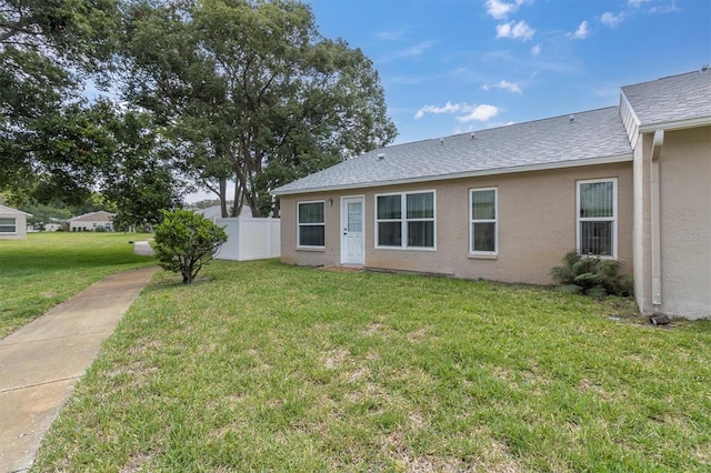 4837 Boonesboro Ct, New Port Richey, FL 34655 - view of front of house featuring stucco siding and a shingled roof