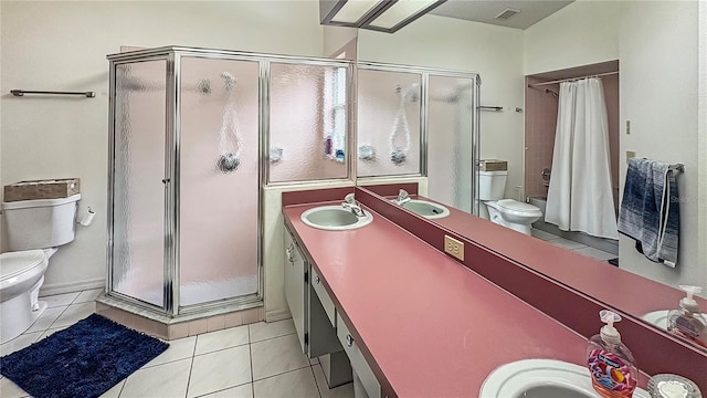 bathroom with toilet, a stall shower, tile patterned flooring, and double vanity