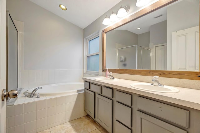 full bathroom with a bath, a stall shower, tile patterned flooring, double vanity, and lofted ceiling