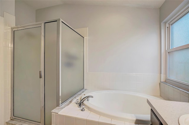 full bath with a garden tub, a stall shower, and vanity
