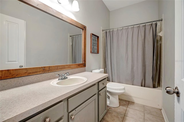 bathroom featuring vanity, tile patterned flooring, toilet, and shower / bathtub combination with curtain