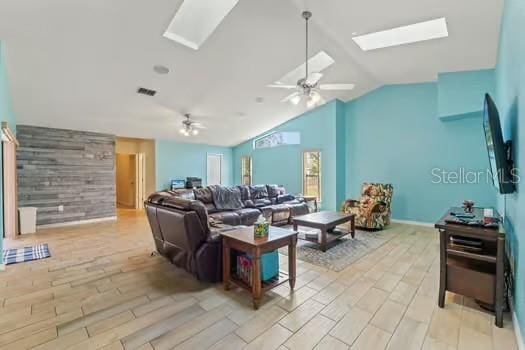 5216 Hope Ln, Spring Hill, FL 34606 - living room with a skylight, lofted ceiling, ceiling fan, and wood tiled floors