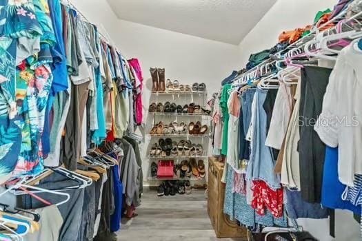 5216 Hope Ln, Spring Hill, FL 34606 - walk in closet featuring wood finished floors