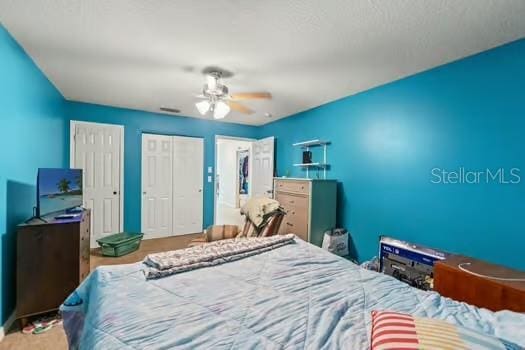 5216 Hope Ln, Spring Hill, FL 34606 - bedroom with a ceiling fan and a closet